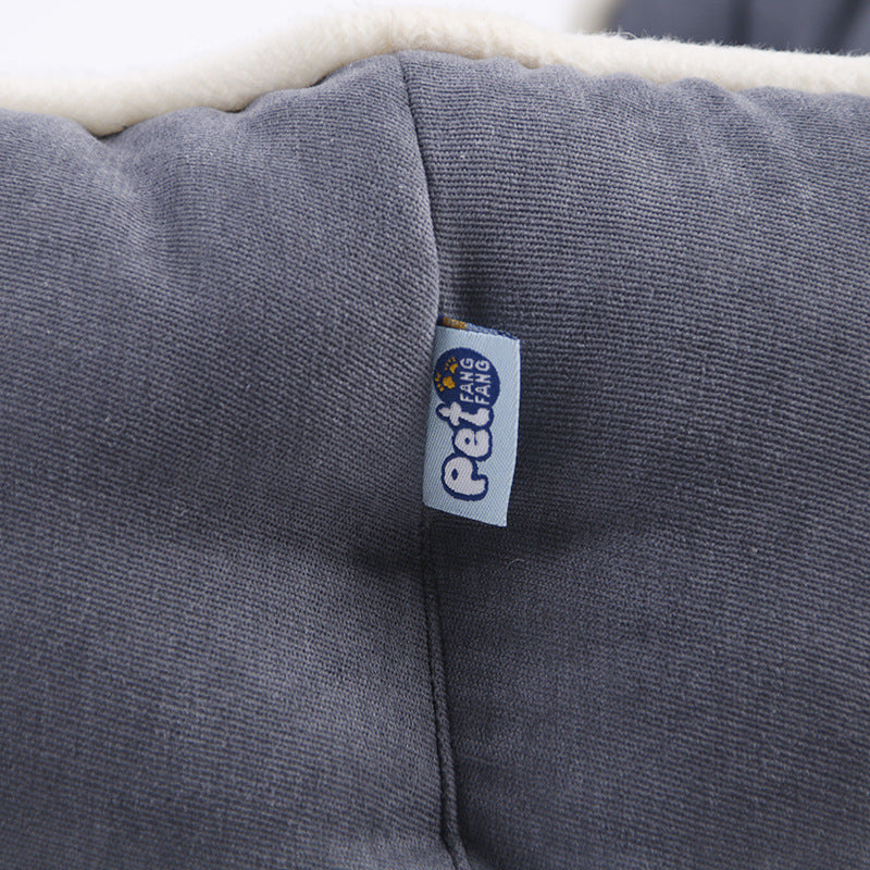 High-quality, durable round pet bed in soft, neutral tones.